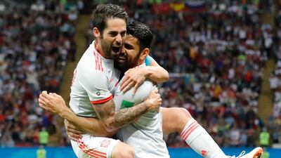 Spain's Diego Costa, right, celebrates with his teammate Isco after scoring his side's opening goal against Iran. Frank Augstein / AP Photo