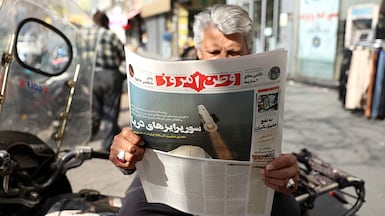 A man in Tehran reads an Iranian newspaper, as nuclear talks between the US and Iran have resumed. EPA