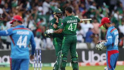 Pakistan's Imad Wasim and Wahab Riaz celebrate winning their World Cup match against Afghanistan. Lee Smith / Reuters