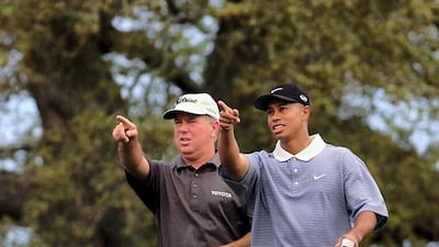 Tiger Woods with Mark O'Meara during a practice round. AFP