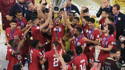 Qatar's team lift the trophy after winning the AFC Asian Cup final against Jordan. AP