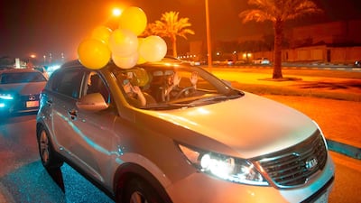 A Saudi woman and her friends celebrate her first time driving on a main street of Khobar City. Hussain Radwan / AFP