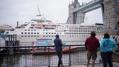 Passersby witnessed a tight squeeze on Friday morning, as the Silversea Silver Wind cruise ship was guided through Tower Bridge. PA