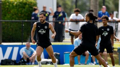 Manchester City's new signing Rayan Cherki, left, and Nathan Ake during training. Reuters