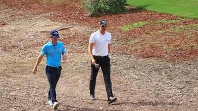 DUBAI, UNITED ARAB EMIRATES - NOVEMBER 16: Chris Paisley of England and Henrik Stenson of Sweden walk on the 13th hole during day two of the DP World Tour Championship at Jumeirah Golf Estates on November 16, 2018 in Dubai, United Arab Emirates. (Photo by Andrew Redington/Getty Images)