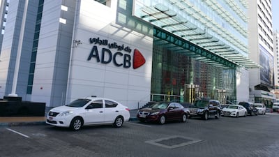 ADCB head office in Abu Dhabi. Deposits from customers in the first half of the year grew 14 per cent to nearly Dh527 billion. Khushnum Bhandari / The National