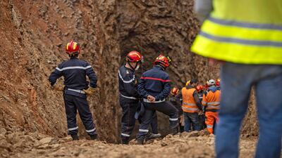 Rescuers during the nerve-racking final stages of a marathon effort to rescue Rayan. AFP
