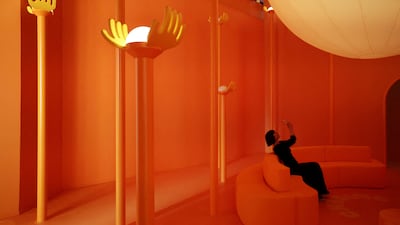 A woman marvels at an installation at the Milan Design Week Fuorisalone exhibition. Reuters