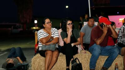 Ana Lilia Cano, left, with daughter Paulina Perez, and Gildardo Leyva, right, wait for relatives. AFP