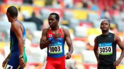 UAE's Omar Juma al-Safa, right, looks at the result monitor after being eliminated in the first round of the heats of the men's 200 metres at the Olympic Games in Beijing.