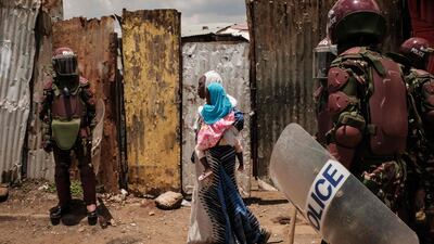 Police block a street during a rally called by opposition leader Raila Odinga, who claims the Kenyan presidential election was stolen from him, in Kibera, Nairobi. AFP