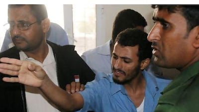 Yemeni Fares Abdullah Saleh (C) gestures as he is sentenced to death at a special criminal court in the southern Yemeni city of Aden on December 11, 2010. Saleh is convicted of bombings that reportedly killed at least three people at a sports club in Aden. AFP PHOTO/STR *** Local Caption *** 855536-01-08.jpg