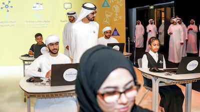 Dozens of young pupils and volunteers who helped translate English material into Arabic were part of the audience in a hall turned into a classroom setting with individual school desks on which school notebooks were placed.