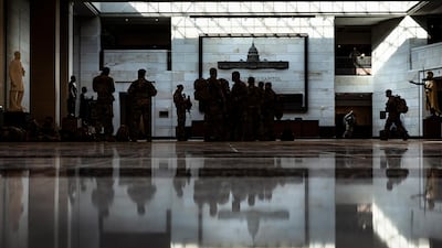 National Guard soldiers gather in the visitors center of the US Capitol building. EPA