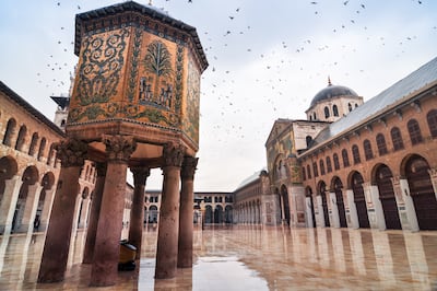 Umayyad Mosque courtyard with the Dome of the Treasury on the left. Getty Images