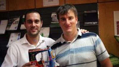 Two of the Abu Dhabi charity team - Jonny Ing, left, and George Foulsham - with a replica of a motorised rickshaw.