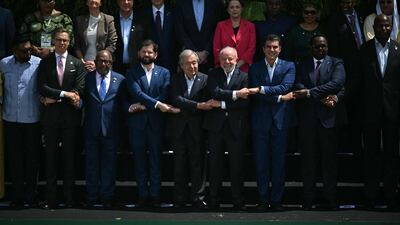 World leaders pose ahead of the Cop30 UN climate conference in Belem, Brazil on Friday. Dozens of countries have failed to update pledges on cutting emissions. AFP