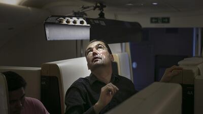 The director of photography checks the light while on set with Nicole Kiddman. The opening scene of the new Etihad commercial shows Kidman flicking through the pages of an inspirational novel at the Strahov library, and in subsequent sequences enjoying the revolutionary cabins and service aboard the new A380.