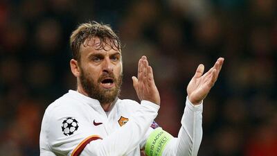 Daniele De Rossi of AS Roma applauds during the Champions League match against Bayer Leverkusen in Germany on Tuesday night. Dean Mouhtaropoulos / Bongarts / Getty Images
