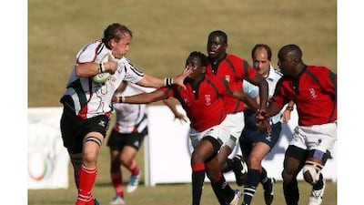 Alistair Thompson, left, breaks free during action in the Emirates Airlines Cup of Nations.