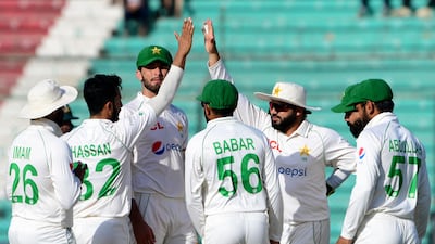 Pakistan celebrate the wicket of Australia's David Warner, who was out for seven at the National Cricket Stadium in Karachi. AFP