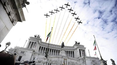 Italy’s Frecce Tricolori (Tricolour Arrows) fly over the Altar of the Fatherland in Venice Square, Rome, Italy. Giuseppe Lami / EPA