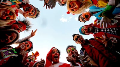 Clowns surround the camera. AFP