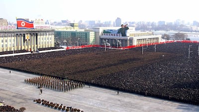 In this Thursday, Dec. 29, 2011 photo released by the Korean Central News Agency and distributed in Tokyo by the Korea News Service, thousands take part in a national memorial service for late North Korean leader Kim Jong Il, in Kim Il Sung Square, in Pyo???
