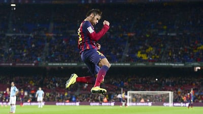 Barcelona's Neymar reacts after scoring against Celta Vigo during a Primera Liga match at the Camp Nou stadium in Barcelona, Spain, on March 26, 2014. Manu Fernandez / AP Photo