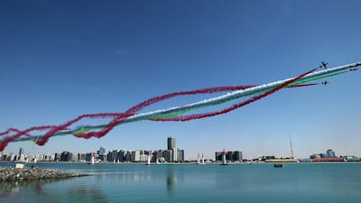 The Al Fursan National Aerobatic Team perform a fly-by over the Corniche. AFP