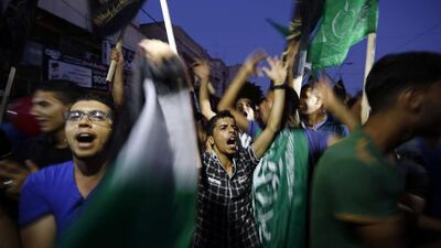 As the truce went into effect, hordes of people surged onto the streets, clapping and chanting songs of victory. Mohammed Abed/ AFP Photo
