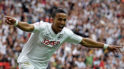 Scott Sinclair celebrates scoring his second goal against Reading in Swansea's 4-2 victory in the play-off final to reach the Premier League.