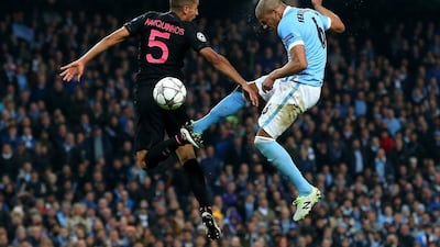 Fernando of Manchester City jumps with Marquinhos of Paris Saint-Germain during the Uefa Champions League quarter final second leg match between Manchester City FC and Paris Saint-Germain at the Etihad Stadium on April 12, 2016 in Manchester, United Kingdom. (Photo by Alex Livesey/Getty Images)