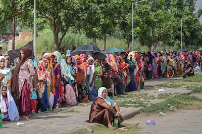 Voters queue up to cast their ballots at a polling station in the seventh and final phase of voting in India's general election, in Chandigarh on Saturday. AFP