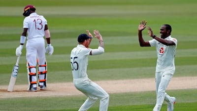 England's Jofra Archer, right, celebrates with Ben Stokes after dismissing West Indies batsman Shamarh Brooks for a duck. AFP