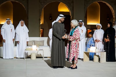 Sheikh Mohamed with Frauke Heard Bey, who received the award on behalf of her late husband David Heard. Abdulla Al Neyadi / UAE Presidential Court