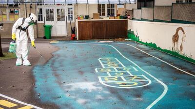 A worker sprays an anti lead decontamination treatment at the St Benoit Elementary School in Paris, France. EPA