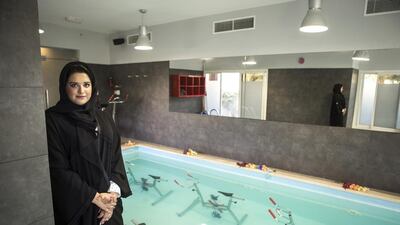 Mira Omar Al Shamsi, shown here at L'Atelier Aquafitness, takes aquabiking classes to ease her Type 1 diabetes. Reem Mohammed / The National