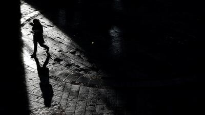 A pedestrian walks through Quincy Market on a warm winter afternoon in downtown in Boston, Massachusetts, US. Brian Snyder / Reuters