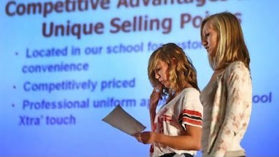 Maryke Blick and Abbie McMillan compete in the Tsu'Chu Biz competition on Wednesday at Al Ain English Speaking School.