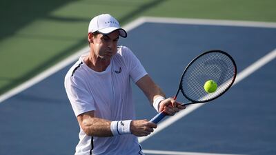 Andy Murray returns the ball as he and Jamie Murray, both of Britain, played a doubles match in the Citi Open tennis tournament against Raven Klaasen, of South Africa, and Michael Venus, of New Zealand, Friday, Aug. 2, 2019, in Washington. (AP Photo/Nick Wass)