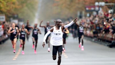 Kenya's Eliud Kipchoge, the marathon world record holder, crosses the finish line during his attempt to run a marathon in under two hours in Vienna, Austria. REUTERS