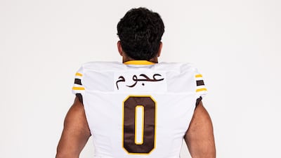 Western Michigan University defensive tackle Mustafi Al-Garawi is one of the first division I US football players to have Arabic script on his jersey's nameplate. The name on the jersey - Ajoum - is his family name, while Al-Garawi is the name of his clan.