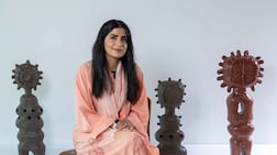 Eman Al Hashemi with ceramic works from The Horizon We Inherit, her new solo exhibition at Iris Projects in Abu Dhabi. Ryan Lim for The National