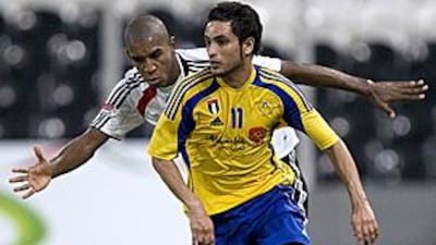 Al Dhafra's new manager Eid Baroud has had just a month with his squad which includes Ahmed Abdulla, right.