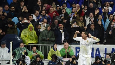 Real Madrid’s Portuguese forward Cristiano Ronaldo celebrates after scoring during the Champions League quarter-final second leg football match Real Madrid v Wolfsburg at the Santiago Bernabeu stadium in Madrid on April 12, 2016. AFP / PIERRE-PHILIPPE MARCOU