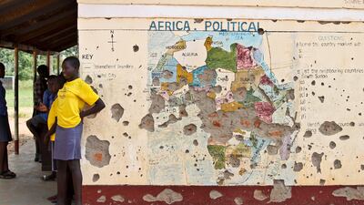 The US is poised to permanently lift sanction on Sudan, US officials said. In this picture, taken on November 15, 2016, students line up outside a classroom with a map of Africa on its wall in Yei in South Sudan. Justin Lynch / The Associated Press