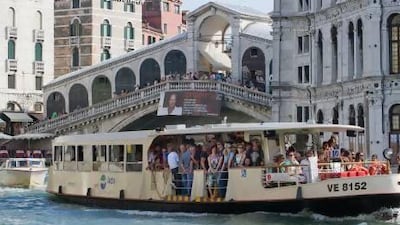A crowded vaporetto sails near Rialto Bridge in Venice, Italy. Fare evasion costs ACTV, the company that runs the ferry service, about €1.5 million a year. Marco Secchi / Getty Images