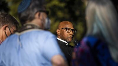 Rev Ray Montgomery of People Acting in Community Together speaks during a vigil held by the Interfaith Community after the shooting. AFP