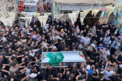 Mourners carry a coffin during the funeral procession at Ain Al Hilweh. AFP